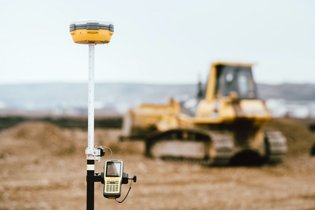 Surveyor equipment GPS system outdoors at highway construction site